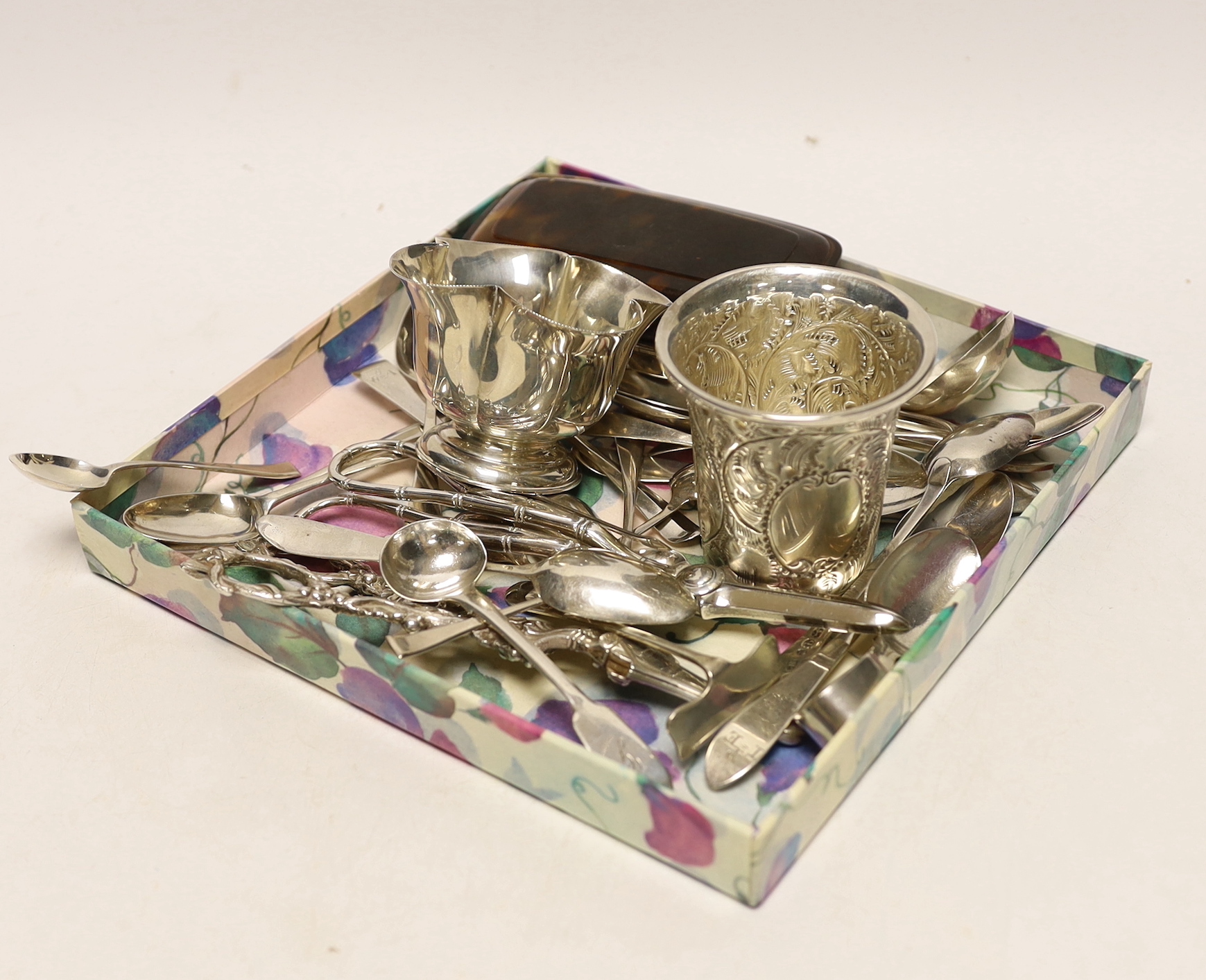 A modern pair of silver vineous grape shears, London, 1977, 16.4cm, one other earlier pair, a sterling beaker, silver bowl and a quantity of assorted silver spoons including 18th century Irish and a pair of preserve spoo